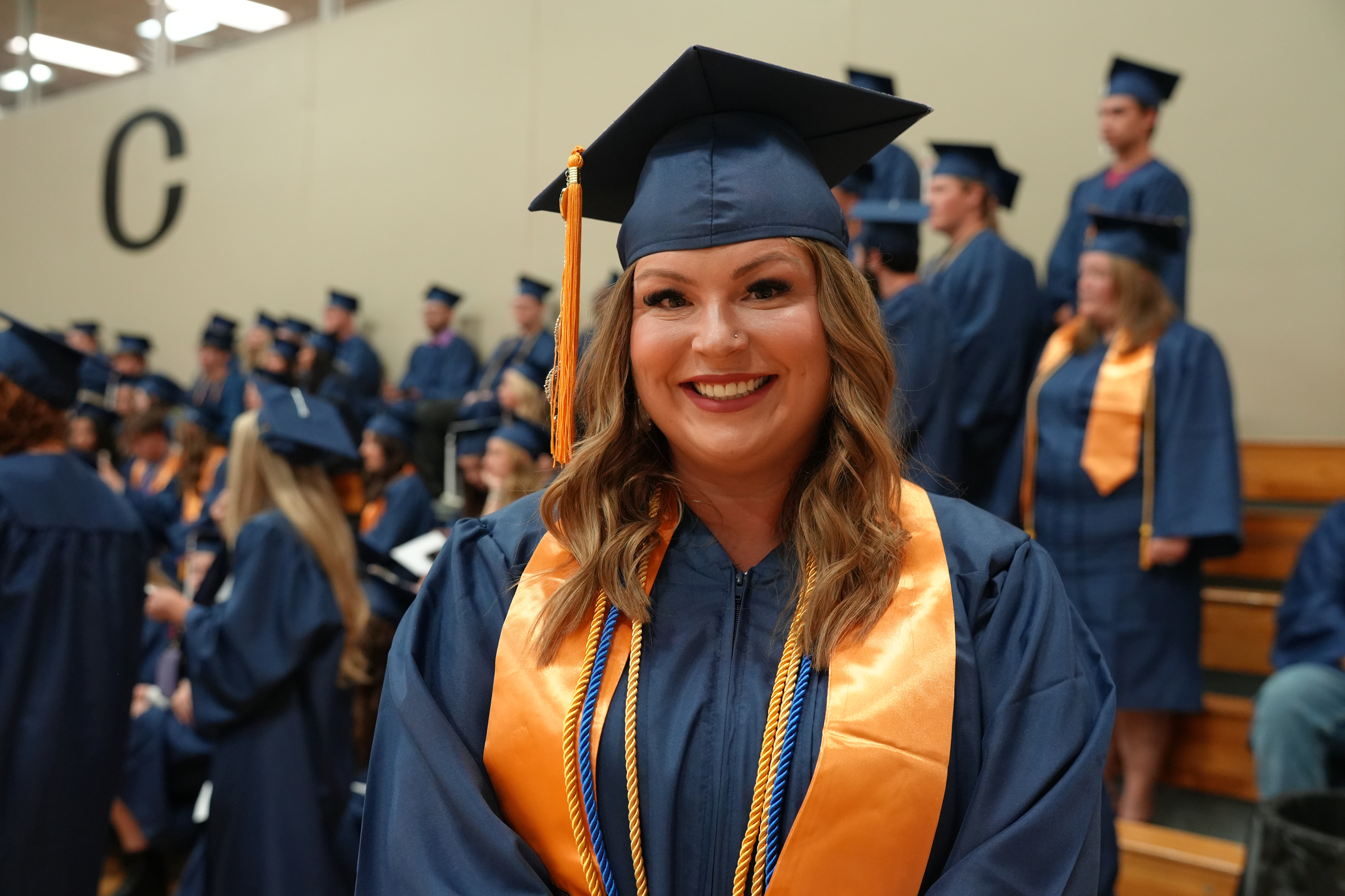 Brittany Conduff posing for a photo before graduation