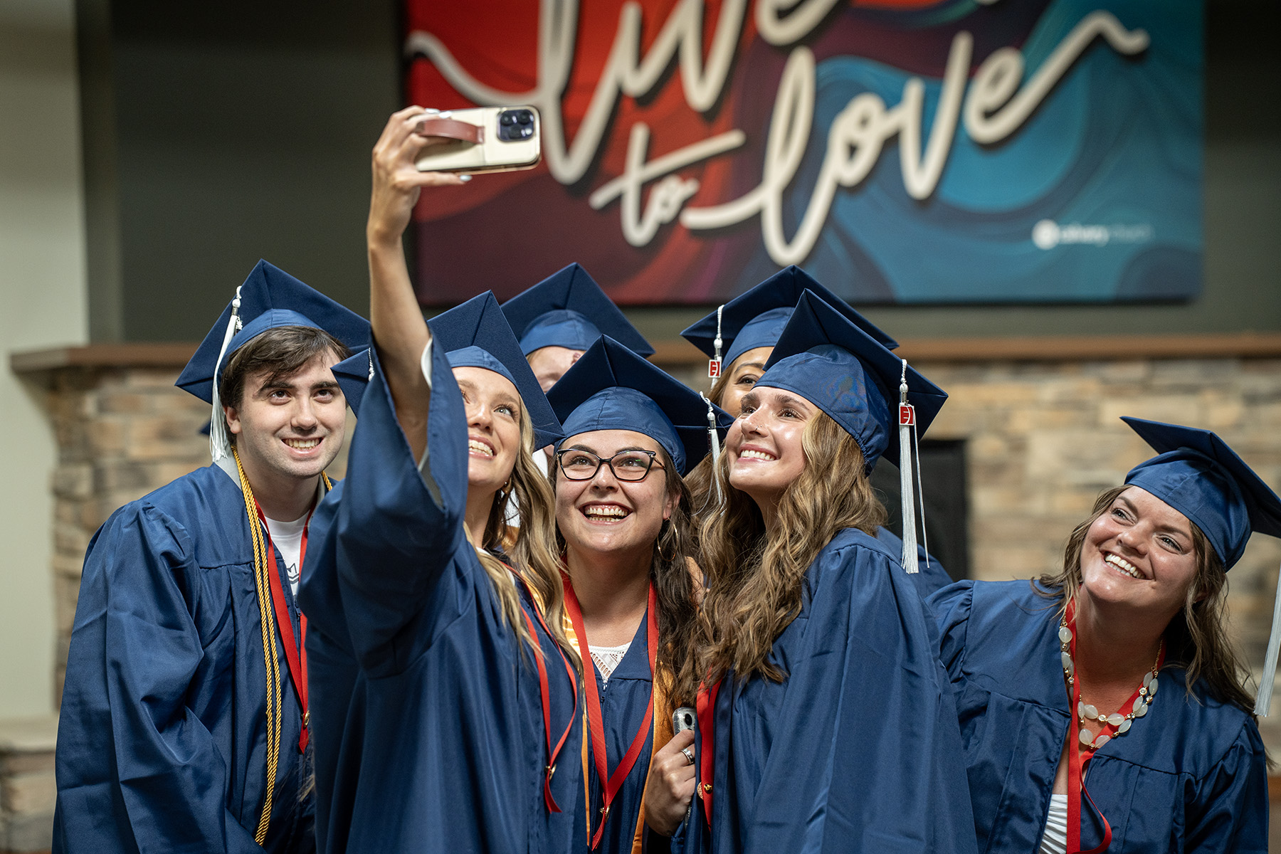 Cassie Littrell posing with friends on graduation day