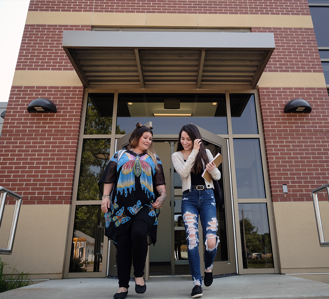 Students walking out of campus entrance