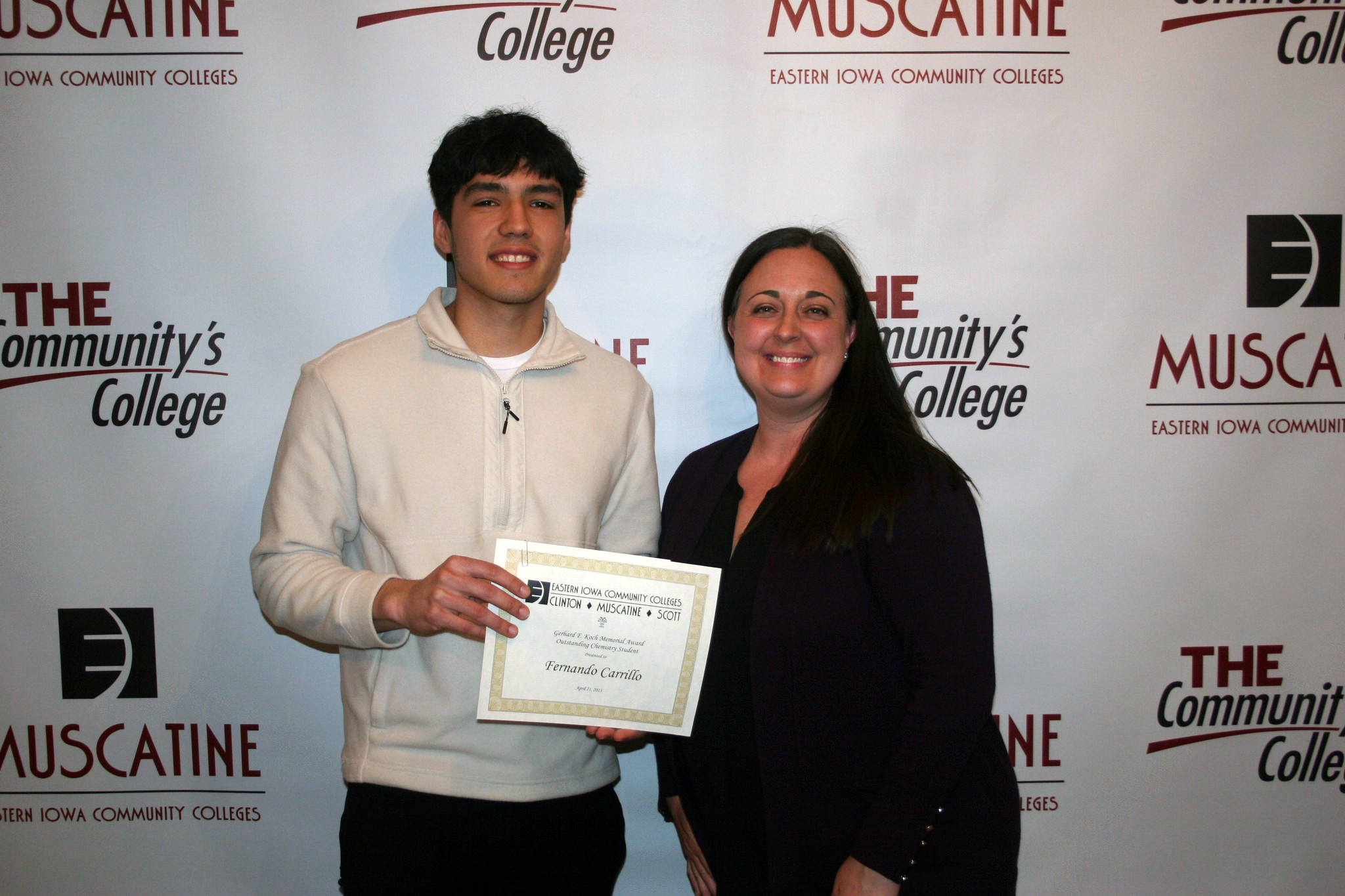 Fernando Carrillo accepting award from Biology Professor Marie Ripslinger-Atwater.