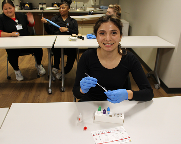 Medical Assisting student practicing injections